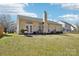 Large backyard featuring a patio with a dining set and a stainless-steel grill at 14429 Planters Knob Ln, Charlotte, NC 28273