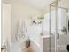 Bright bathroom with a tub, shower, and built-in shelving for storage at 14429 Planters Knob Ln, Charlotte, NC 28273