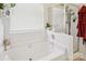 Bathroom showcasing a soaking tub and a walk-in shower at 14429 Planters Knob Ln, Charlotte, NC 28273