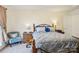 Bedroom with carpet, a bed, a dresser, and a chair at 14429 Planters Knob Ln, Charlotte, NC 28273