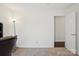 Bedroom featuring an open door and neutral-colored carpet at 14429 Planters Knob Ln, Charlotte, NC 28273