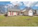 Lovely single-story home with red shutters, a well-kept lawn, and a cozy, inviting curb appeal at 14429 Planters Knob Ln, Charlotte, NC 28273