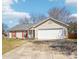Charming single-story home featuring a two-car garage, red shutters, and a well-manicured front yard at 14429 Planters Knob Ln, Charlotte, NC 28273