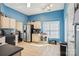 Bright kitchen with blue walls, stainless steel appliances, and tile flooring at 14429 Planters Knob Ln, Charlotte, NC 28273