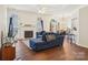 Bright living room features a fireplace, hardwood floors, and an open layout at 14429 Planters Knob Ln, Charlotte, NC 28273