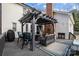 Charming outdoor deck with furniture, a grill, and a decorated pergola at 1509 Orange Hill Ct, Gastonia, NC 28056