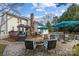 Beautiful backyard with a pool, fire pit, lounge chairs, and a deck with a pergola at 1509 Orange Hill Ct, Gastonia, NC 28056