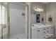 Bathroom boasting a glass shower, double sink vanity, and well-lit mirror at 1509 Orange Hill Ct, Gastonia, NC 28056