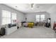Large bedroom featuring windows for natural light, plus soft carpet at 1509 Orange Hill Ct, Gastonia, NC 28056