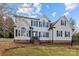 Charming two-story home with white siding, black shutters, and a well-manicured lawn at 1509 Orange Hill Ct, Gastonia, NC 28056
