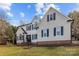 Charming two-story home with white siding, black shutters, and a well-manicured lawn at 1509 Orange Hill Ct, Gastonia, NC 28056