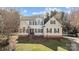 Charming two-story home with white siding, black shutters, and a well-manicured lawn at 1509 Orange Hill Ct, Gastonia, NC 28056