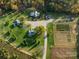 An aerial view of a property with a large home, guest house, and well-manicured grounds at 153 Badenyon Pl, Union Grove, NC 28689