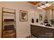 Contemporary bathroom with a marble vanity, updated fixtures, and ample storage space, providing convenience and style at 153 Badenyon Pl, Union Grove, NC 28689