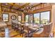 Elegant dining room with a long wooden table, seating for fourteen, and hardwood floors at 153 Badenyon Pl, Union Grove, NC 28689