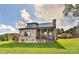 Charming stone and shingle home with a covered porch, well-manicured lawn, and inviting curb appeal at 153 Badenyon Pl, Union Grove, NC 28689