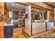 Open-concept kitchen with stainless steel appliances, wooden floors, and a breakfast bar, perfect for entertaining at 153 Badenyon Pl, Union Grove, NC 28689