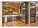 Well-equipped kitchen featuring a wine cooler, stainless appliances and wood cabinets, great for hosting gatherings at 153 Badenyon Pl, Union Grove, NC 28689