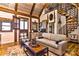 Cozy living room featuring exposed beams, a spiral staircase, and comfortable seating at 153 Badenyon Pl, Union Grove, NC 28689