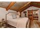 Elegant main bedroom with vaulted ceilings, neutral tones, and a barn door, offering a serene retreat at 153 Badenyon Pl, Union Grove, NC 28689