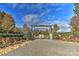 Badenyon Ranch entrance featuring stone walls, wood gates, and gravel drive under a blue sky at 153 Badenyon Pl, Union Grove, NC 28689