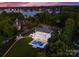 An aerial view showcases a stunning estate with a pool, lush landscaping, and a waterfront location at 16439 Jetton Rd, Cornelius, NC 28031