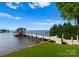 A private dock and boat slip provide direct access to the serene waters, surrounded by lush greenery at 16439 Jetton Rd, Cornelius, NC 28031