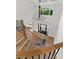 View of bright and airy foyer featuring a staircase, hardwood floors, and a modern chandelier at 16439 Jetton Rd, Cornelius, NC 28031