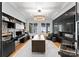 Sophisticated home office with custom built-ins, a modern fireplace, and abundant natural light at 16439 Jetton Rd, Cornelius, NC 28031