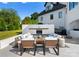 A cozy outdoor seating area with a fireplace, comfortable sofas, and stylish decor for relaxation and entertainment at 16439 Jetton Rd, Cornelius, NC 28031