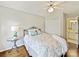 Cozy bedroom featuring natural light, ceiling fan, and ensuite bathroom at 18322 Indian Oaks Ln, Davidson, NC 28036