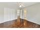 Spacious bedroom with hardwood floors, closet and ensuite bathroom access at 18322 Indian Oaks Ln, Davidson, NC 28036