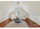 Upstairs bonus room with an accent rug, vaulted ceilings and lots of natural light at 18322 Indian Oaks Ln, Davidson, NC 28036