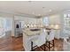 Bright kitchen with an island, stainless steel appliances, granite countertops, and ample cabinet space at 18322 Indian Oaks Ln, Davidson, NC 28036