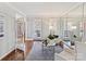 Cozy living room with hardwood floors, French doors, and mirrored wall at 18322 Indian Oaks Ln, Davidson, NC 28036