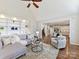 Living room featuring a built in cabinet, open access to the dining area, hardwood floors, and a sectional at 18322 Indian Oaks Ln, Davidson, NC 28036