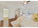 Spacious main bedroom with hardwood floors leads to the walk-in closet and main bathroom at 18322 Indian Oaks Ln, Davidson, NC 28036