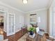 Office featuring hardwood floors, a large window, and access to other rooms at 18322 Indian Oaks Ln, Davidson, NC 28036