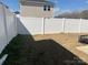 Home's backyard area is enclosed with white fencing, clearly defining the yard's boundaries and providing privacy at 202 J.P. Dr # 183, Albemarle, NC 28001