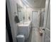 Modern bathroom features a double sink vanity with a large mirror, adjacent to a sleek, tiled shower at 202 J.P. Dr # 183, Albemarle, NC 28001