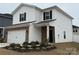 Charming two-story home with white siding, black shutters, and a brick-accented front exterior and a well-manicured lawn at 202 J.P. Dr # 183, Albemarle, NC 28001