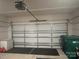 Spacious garage with ample room for vehicles and storage, equipped with an automatic door opener and black floor mats at 202 J.P. Dr # 183, Albemarle, NC 28001