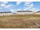 View of the backyard space with multi-Gathering homes in the background at 2026 Talbert Ct, Charlotte, NC 28214