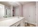 Bathroom featuring double sink vanity, large mirror, and a glass door shower at 2026 Talbert Ct, Charlotte, NC 28214
