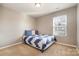 Bedroom featuring neutral walls and flooring, with a single window for natural light at 2026 Talbert Ct, Charlotte, NC 28214