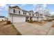 Charming townhome featuring attached garage and inviting curb appeal at 2026 Talbert Ct, Charlotte, NC 28214