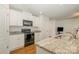 Lovely kitchen with a black microwave and granite counter tops at 2026 Talbert Ct, Charlotte, NC 28214
