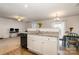 The kitchen area has a half wall separating it from the carpeted living spaces at 2026 Talbert Ct, Charlotte, NC 28214