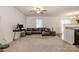 Spacious living room with a ceiling fan and lots of natural light at 2026 Talbert Ct, Charlotte, NC 28214