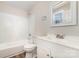 Bathroom featuring tiled shower, tub, and vanity sink with white cabinets at 2206 Hillcrest Ave, Albemarle, NC 28001